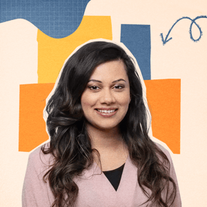 Deesha Laxsav, a smiling woman with long dark hair