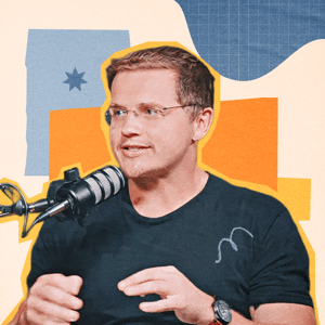 Ryan Atkinson, a smiling man with short hair crossing his arms over his chest