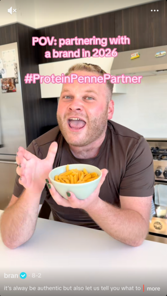 Screencap of TikTok video. A man is holding a bowl of pasta.